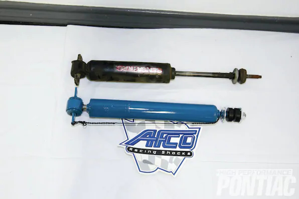 20. After consulting with PTFB, Randy opted for non-adjustable AFCO shocks (separately priced at $138 a pair). PTFB worked with AFCO to custom calibrate a set of front and rear stock-mount twin-tube shock absorbers. They feature firm calibration, and each shock is tailored to the overall ride-height adjustment so the piston stroke is centered to maintain consistent performance. A front Monroe and rear AFCO shock are displayed, top and bottom respectively.