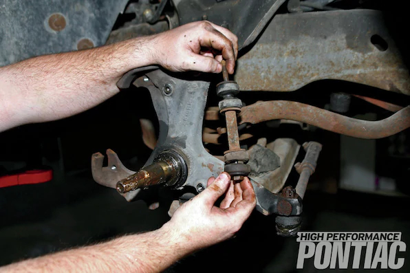 6. An illustration of the components comprising the end-link is shown to demonstrate how it attaches to the lower control arm and sway bar and the overall condition of the bushings. These bushings were replaced within the last five years, as the rubber was showing minor cracking where the bushings are compressed and slight deformation.